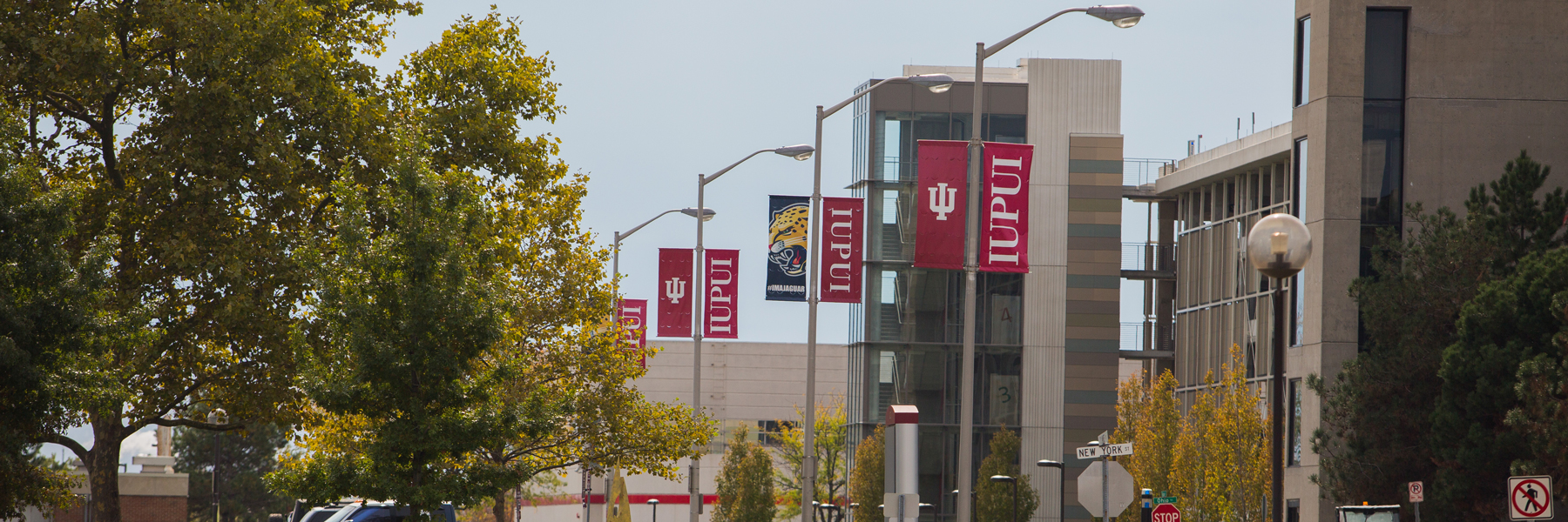 Outside picture of a parking garage and banners 