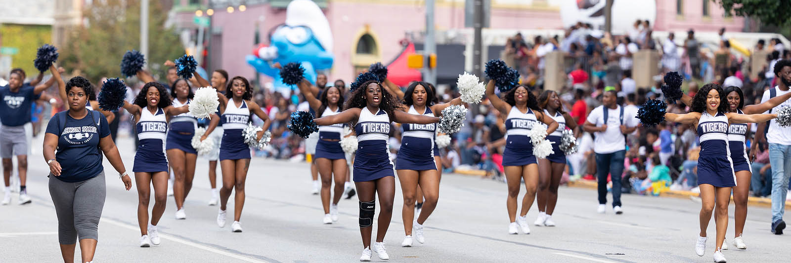 Stock photo of cheerleaders and parade participants from Circle City Classic, purchased from Big Stock